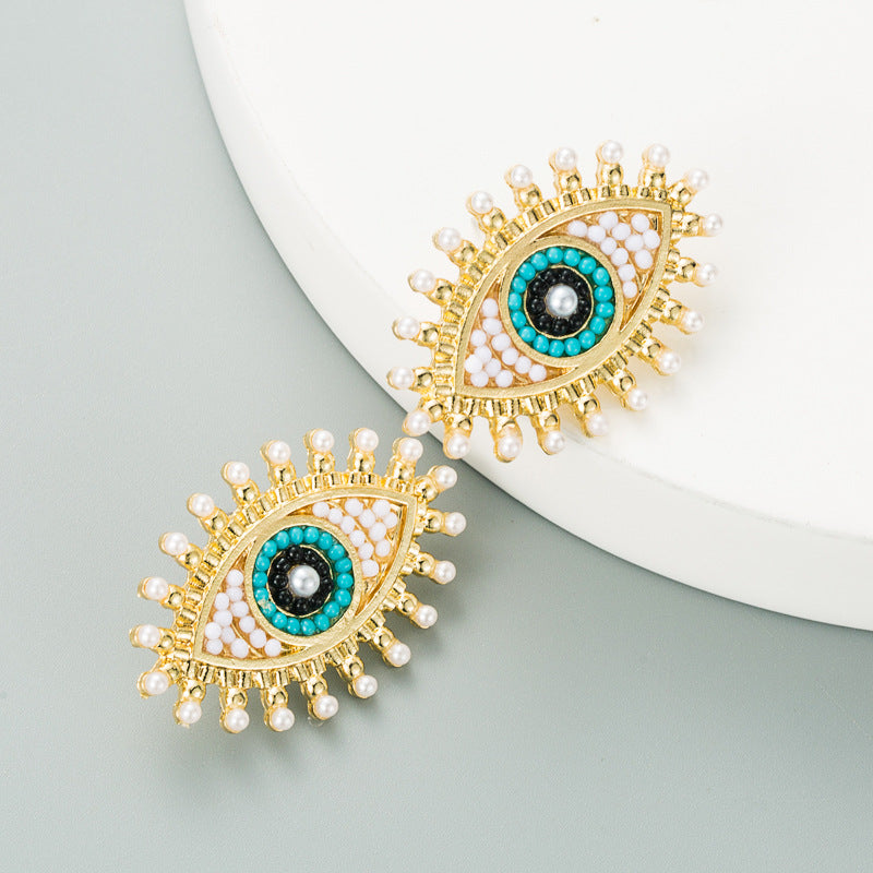 Wholesale Devil's Eye Alloy Inlaid Pearl Color Rhinestone Earrings